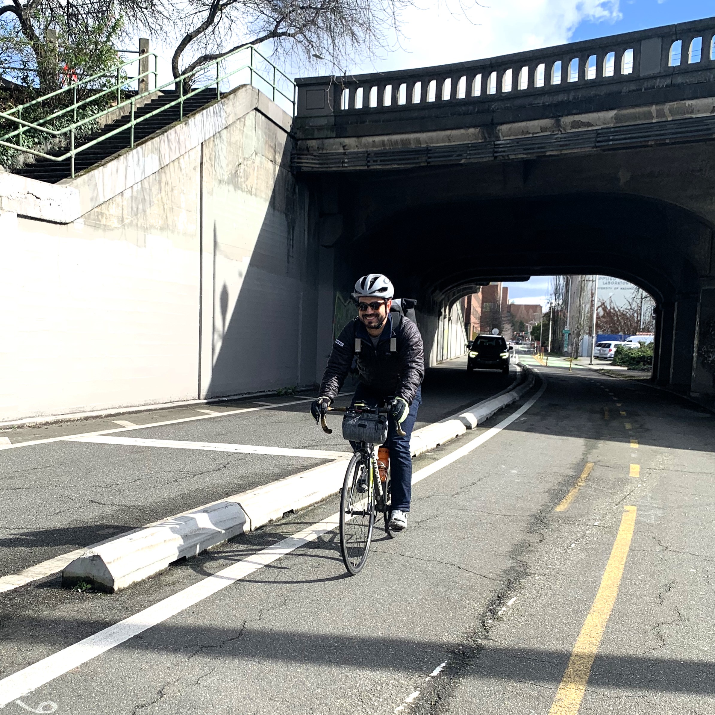 Tyler rides in the protected bike lanes his work helped create